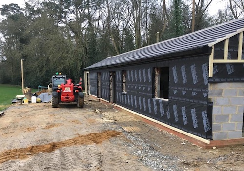 Photo of tractor by new construction