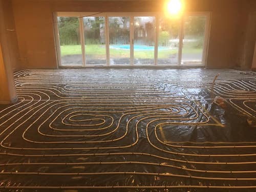 Photo of underfloor heating being laid